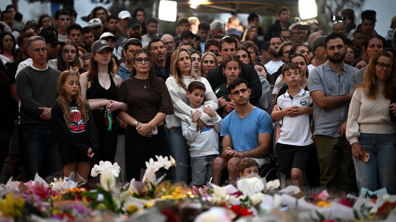 Mourners attend a vigil at a memorial in Bondi Beach