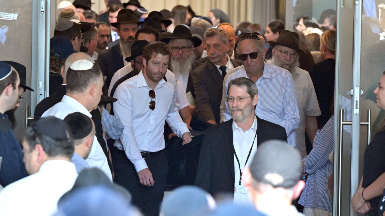 Rabbi Yaakov Levitan's casket is carried out