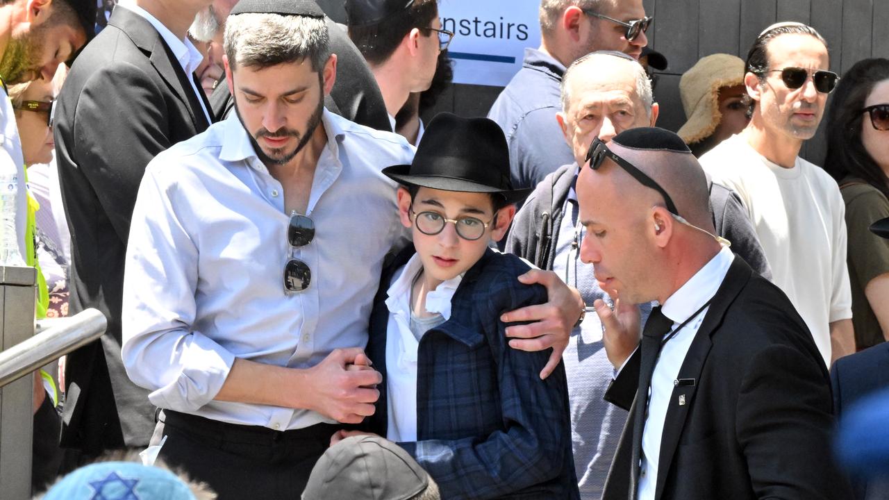 People leave the Chabad of Bondi Synagogue
