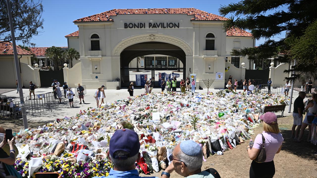 People take photos of the memorial at Bondi Beach (file image)