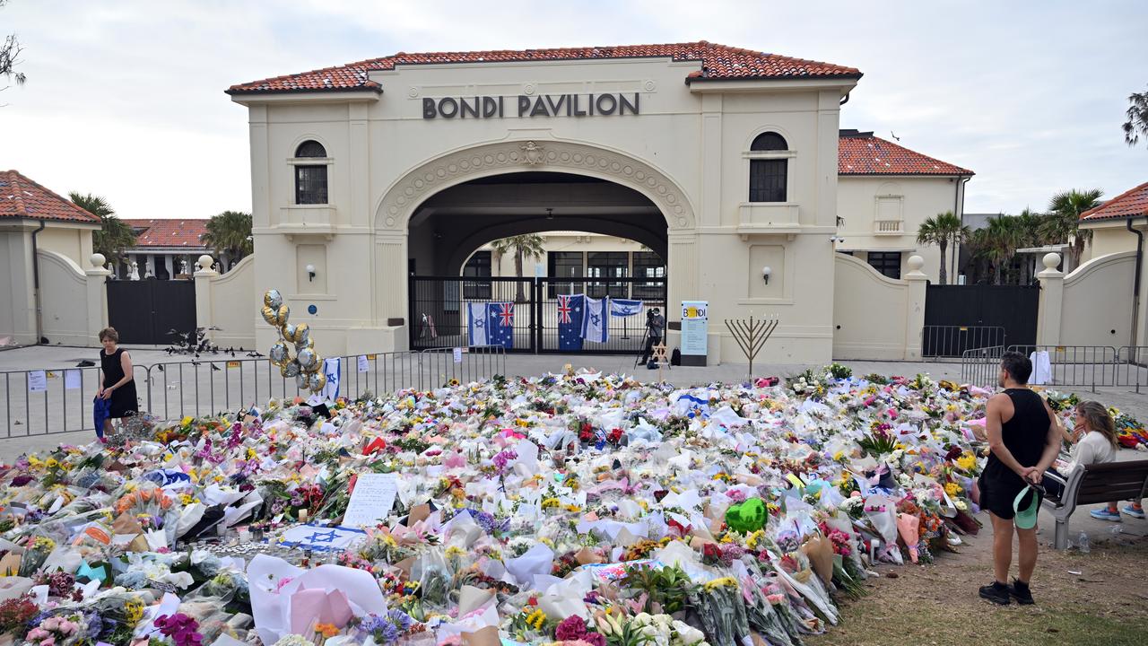 Flowers are seen at a makeshift memorial at the Bondi Pavillion