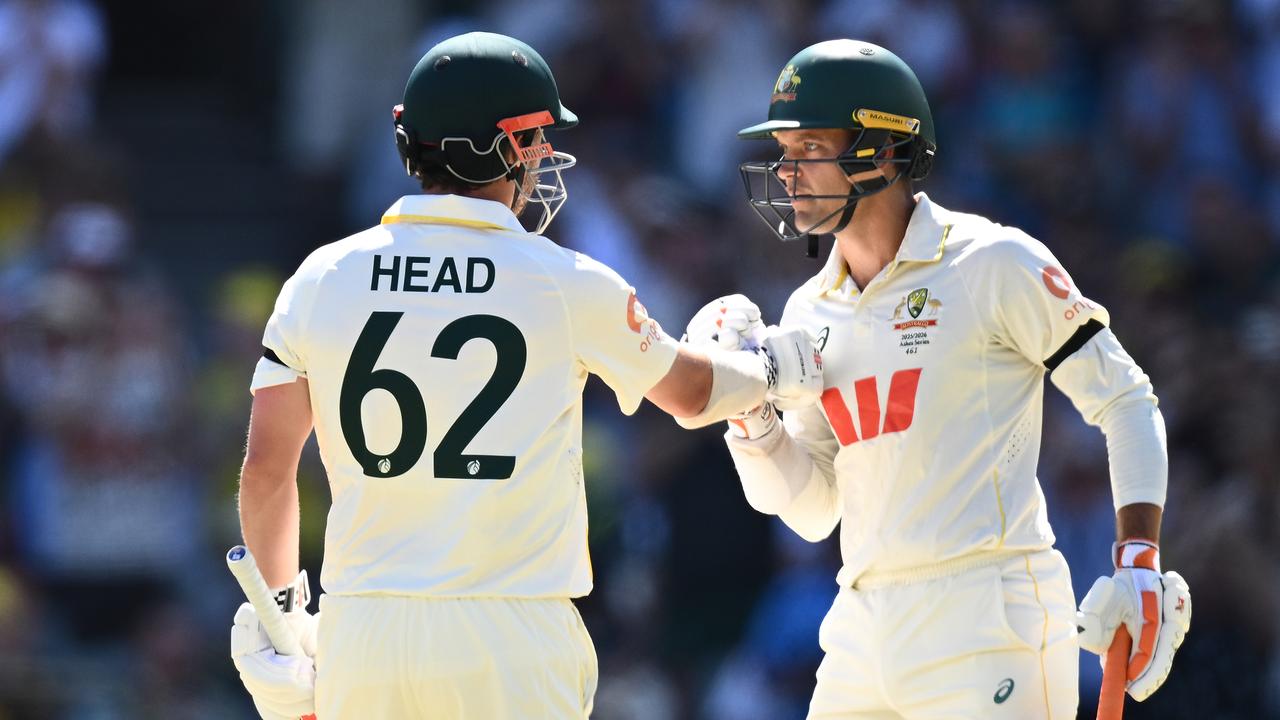 Travis Head with Alex Carey.