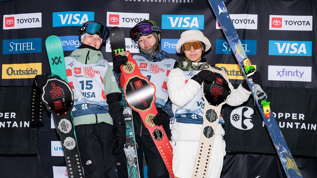 Indra Brown on the podium with Zoe Atkin and Kexin Chang.