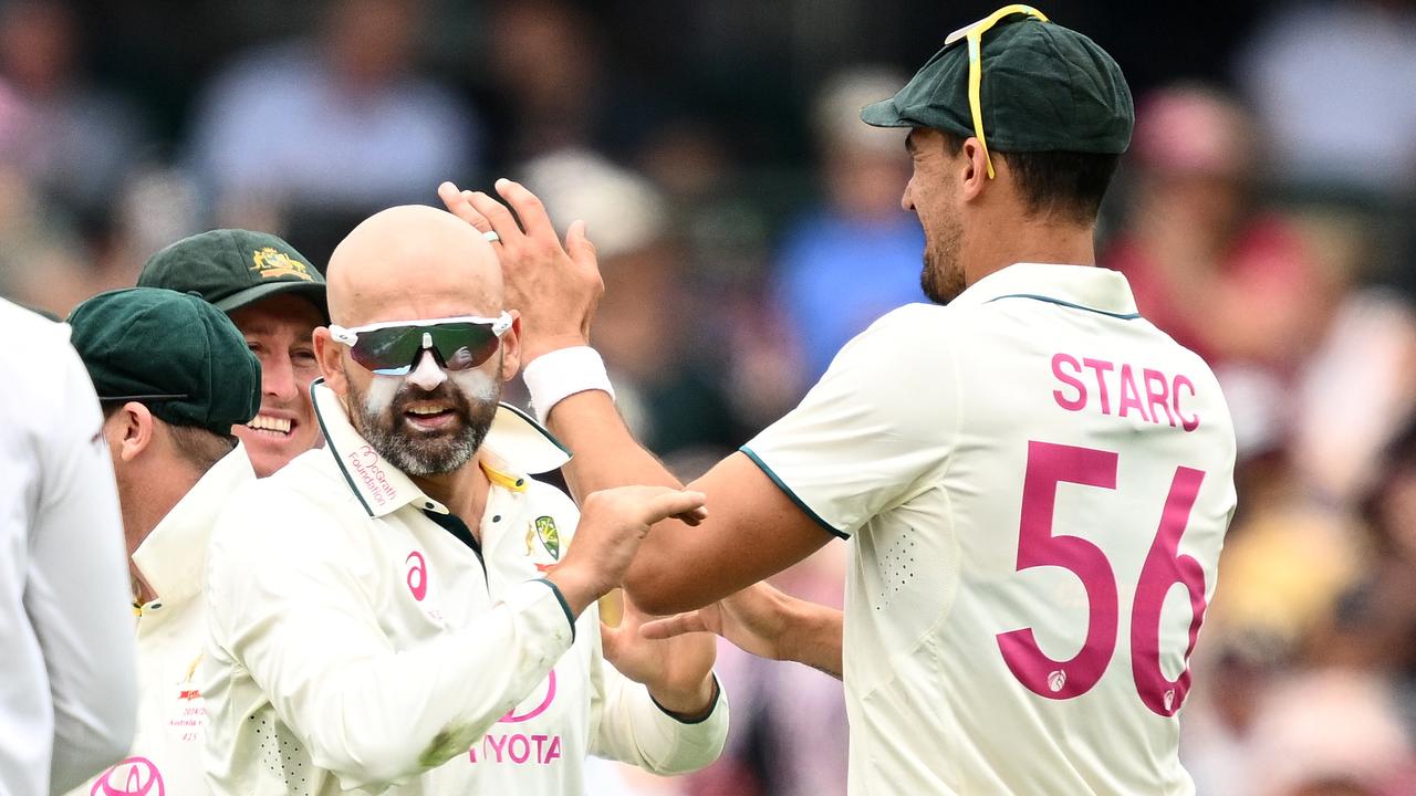 Nathan Lyon of Australia (centre)
