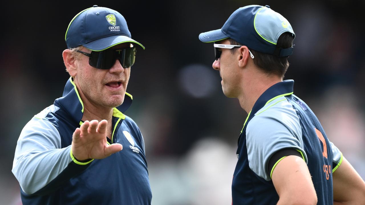 Australian coach Andrew McDonald (left)