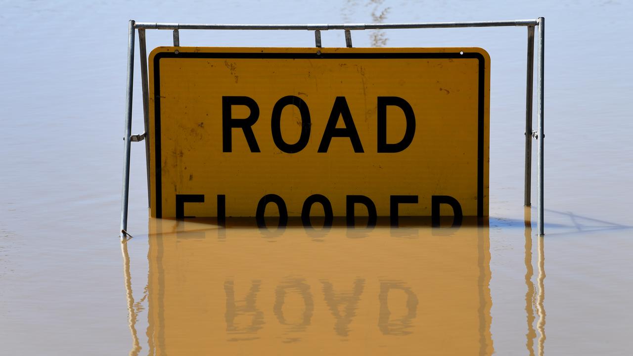 A road flooded sign