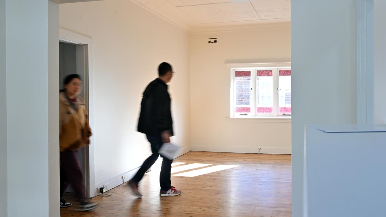 Potential buyers inspect a house