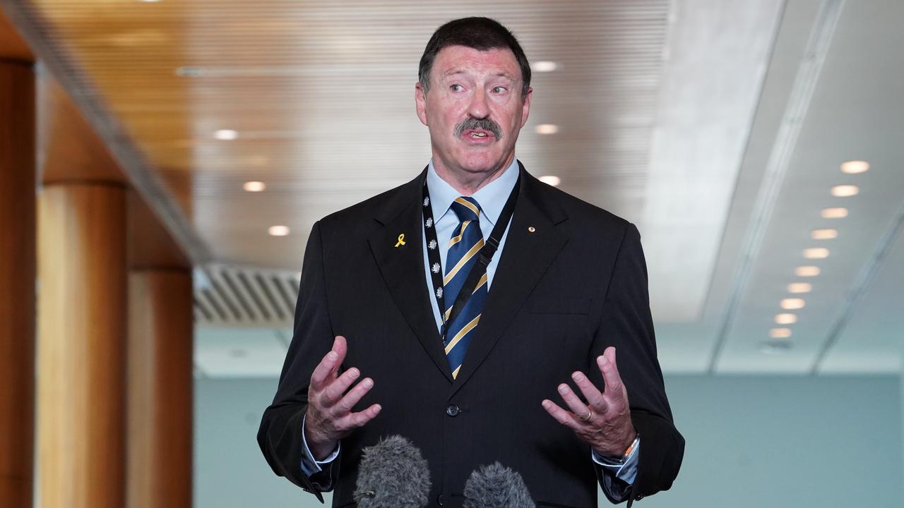 Dr Mike Kelly speaks to media