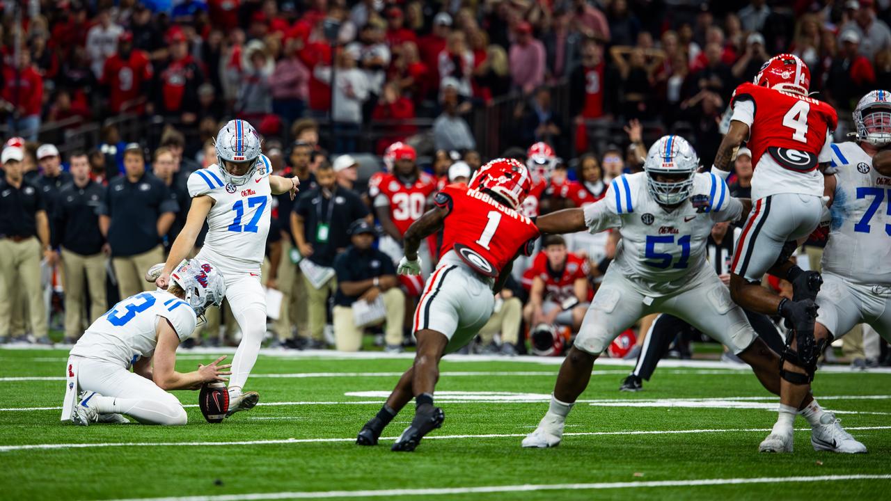 Oscar Bird holds the ball for Lucas Carneiro