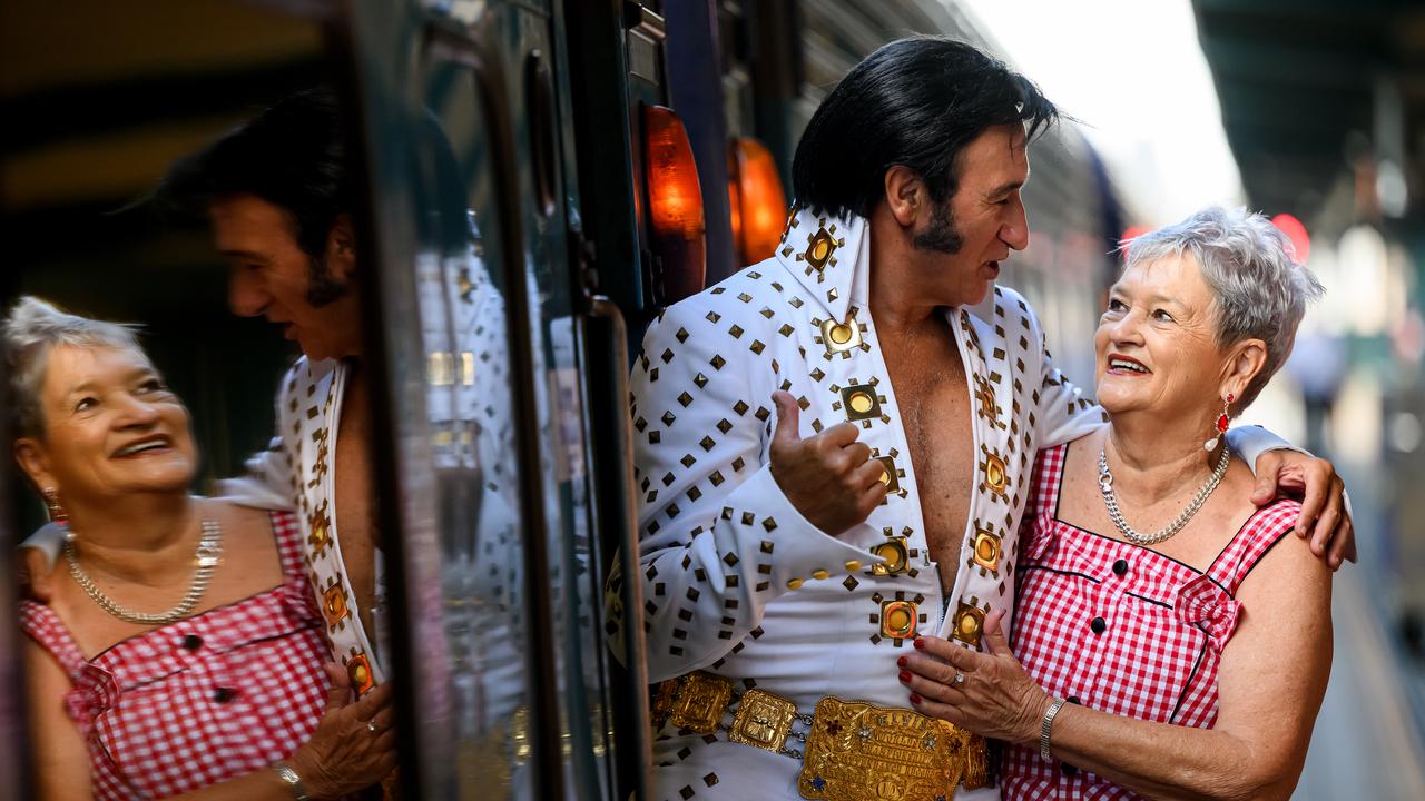 An Elvis impersonator and a fan