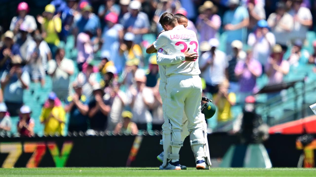Usman Khawaja receives a warm hug from Marnus Labuschagne