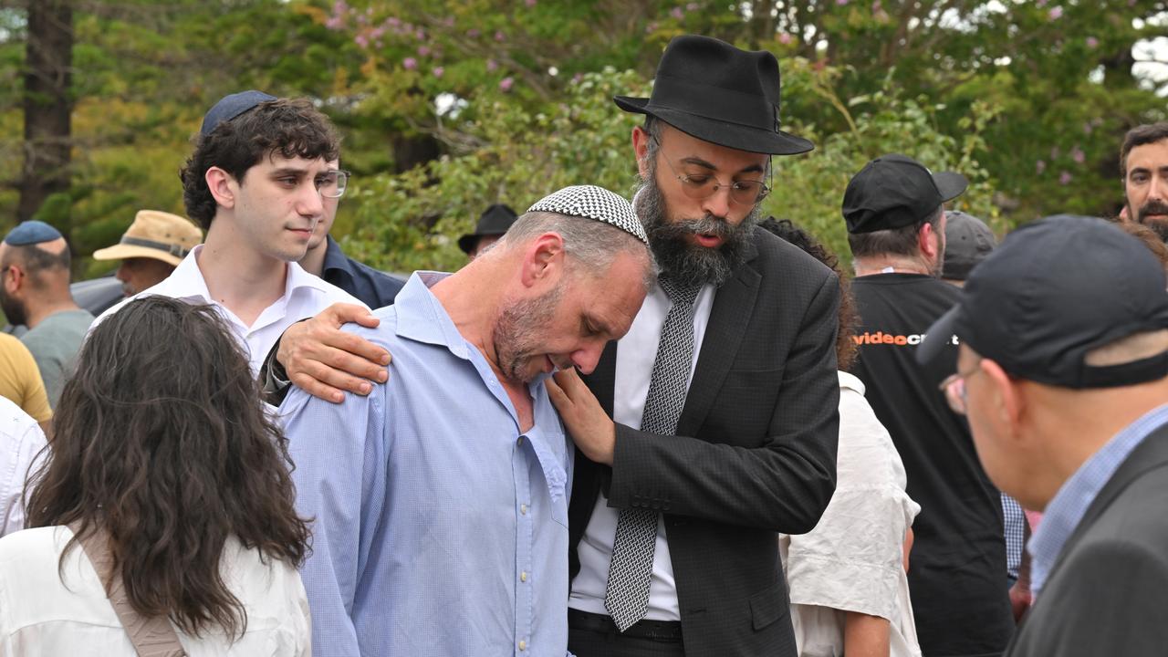 Mourners after the funeral for Edith Brutman at the Rookwood Cemetery