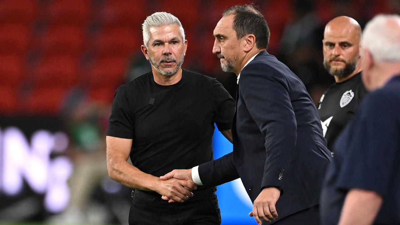 Steve Corica shakes hands with Michael Valkanis.