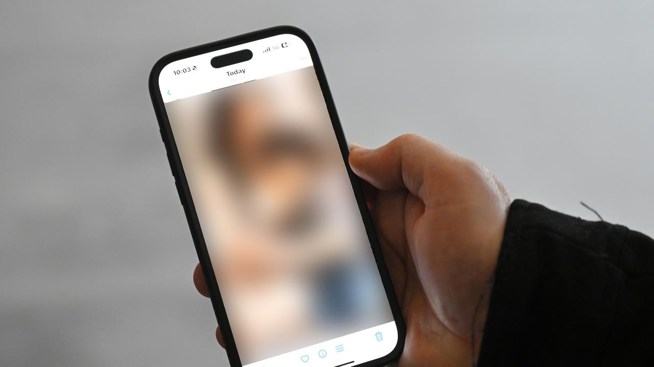 AI abuse material on mobile phone (file)