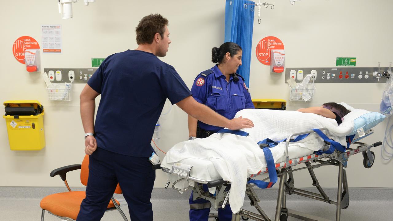 Ambulance and medical staff attend to a patient