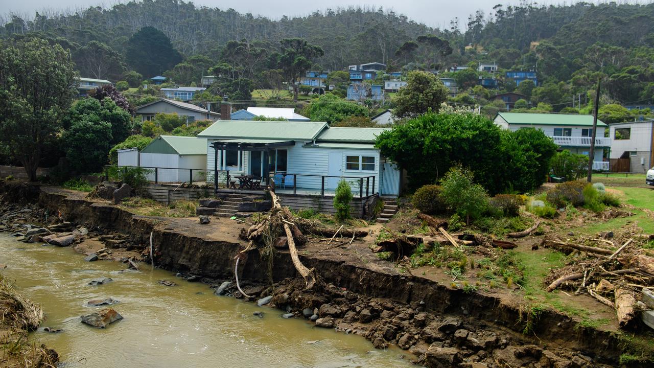 A house sits very close to a gouged out Separation Creek, 