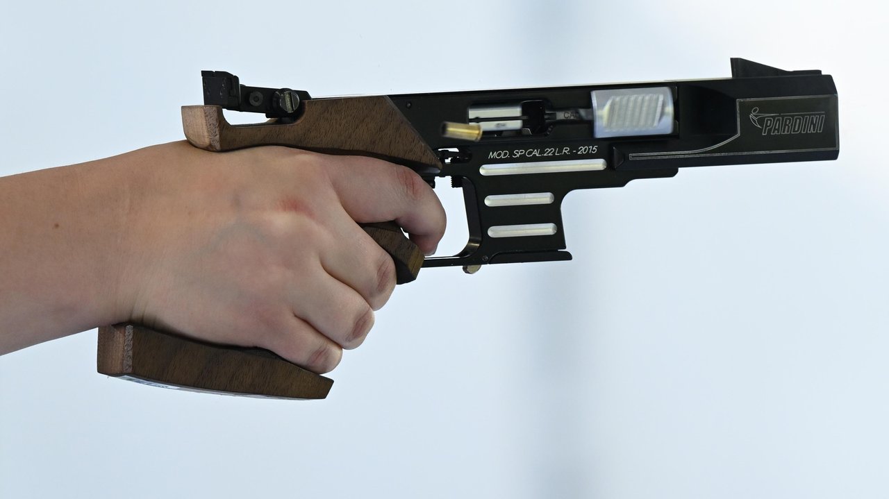 person holding an air pistol