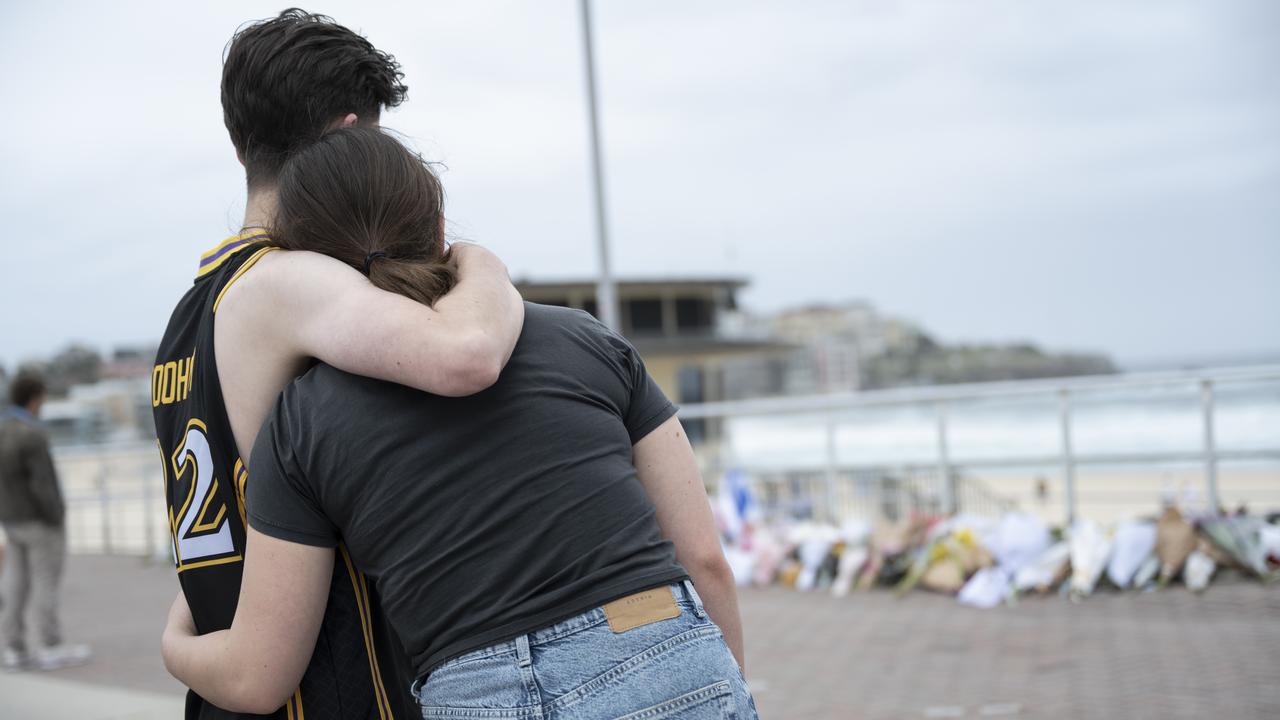 People at a memorial for the Bondi victims