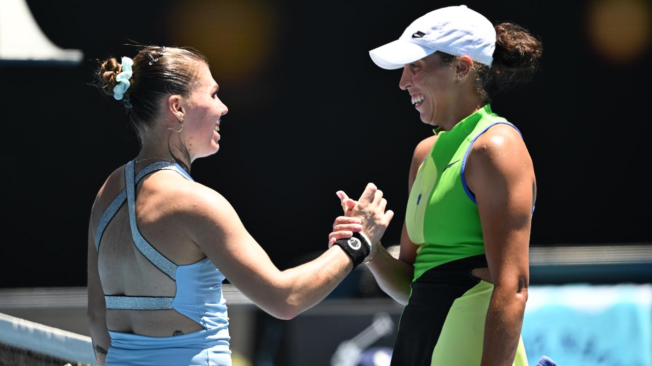 Oleksandra Oliynykova shakes hands with Madison Keys