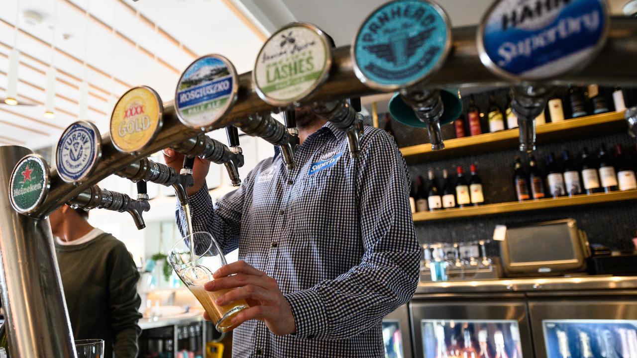 A barman pouring a beer (file)