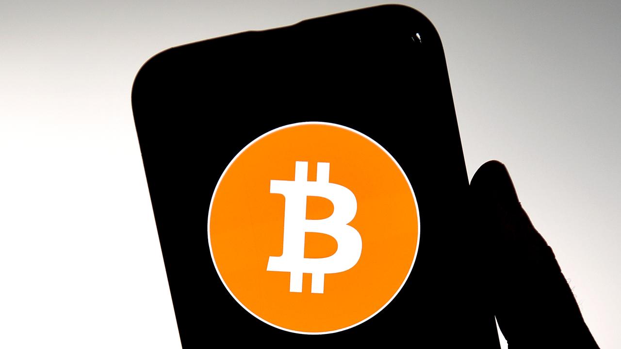 Bitcoin logo on phone (file)