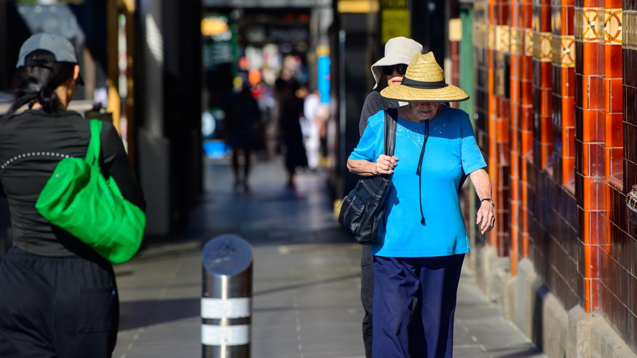 People are seen during hot weather in Melbourne