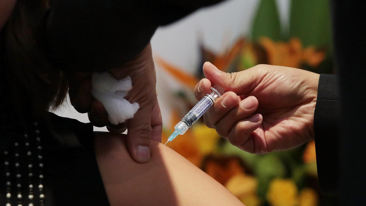 A woman gets a flu shot (file image)