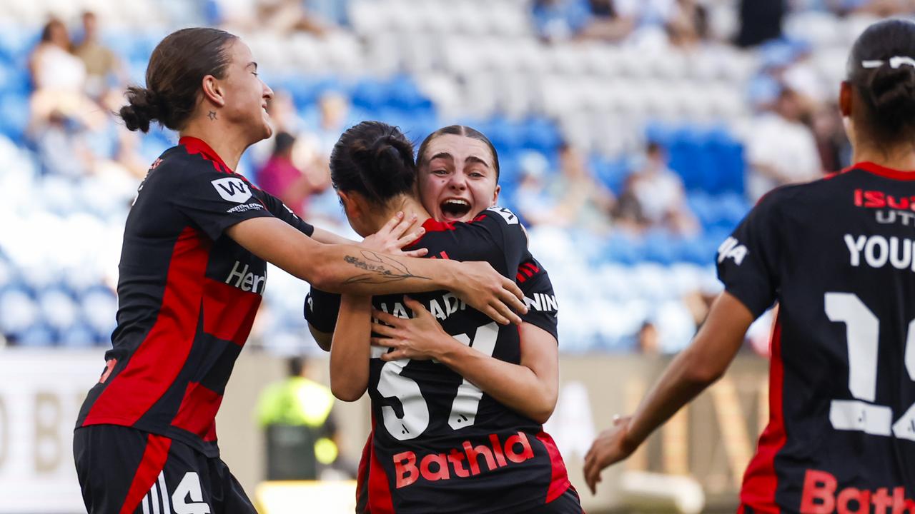 Wanderers teammates rush to Amy Chessari