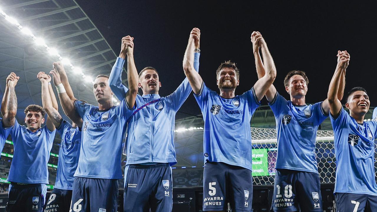 Sydney FC players celebrate.