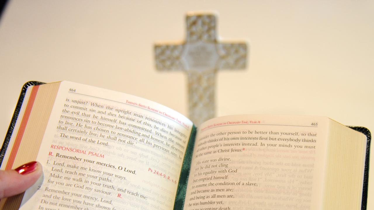 Woman reads from the Bible (file)