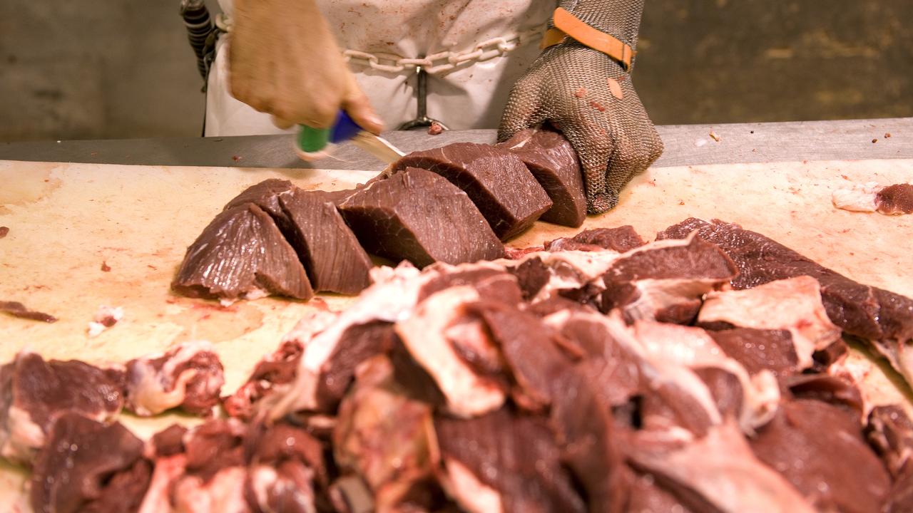 A person processes meat (file image)