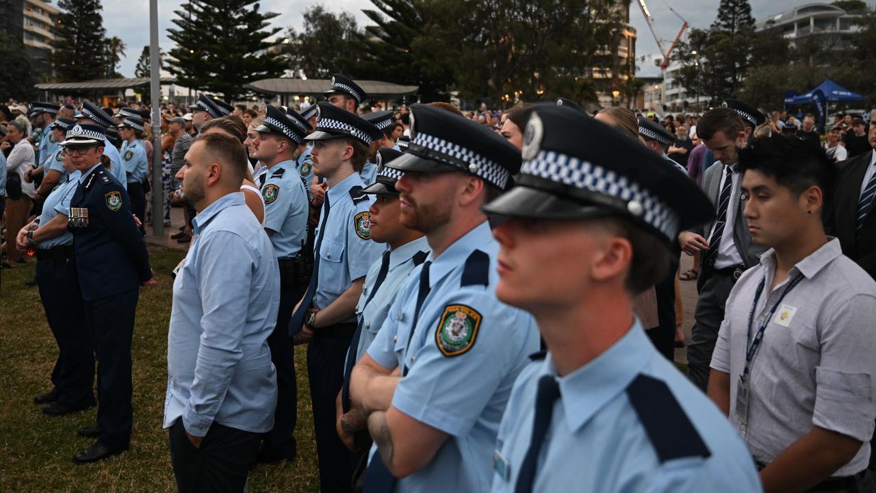 Police join a crowd at Bondi
