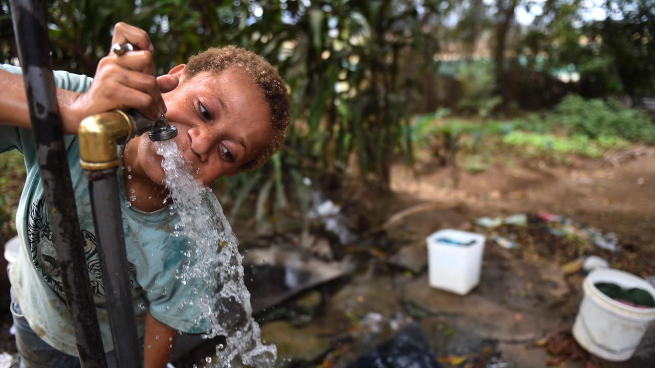 A child drinks water from a tap (file image)
