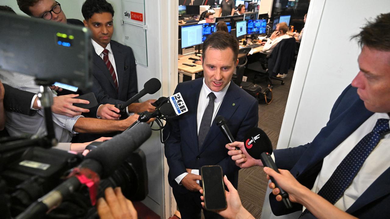 Alex Hawke speaks to journalists