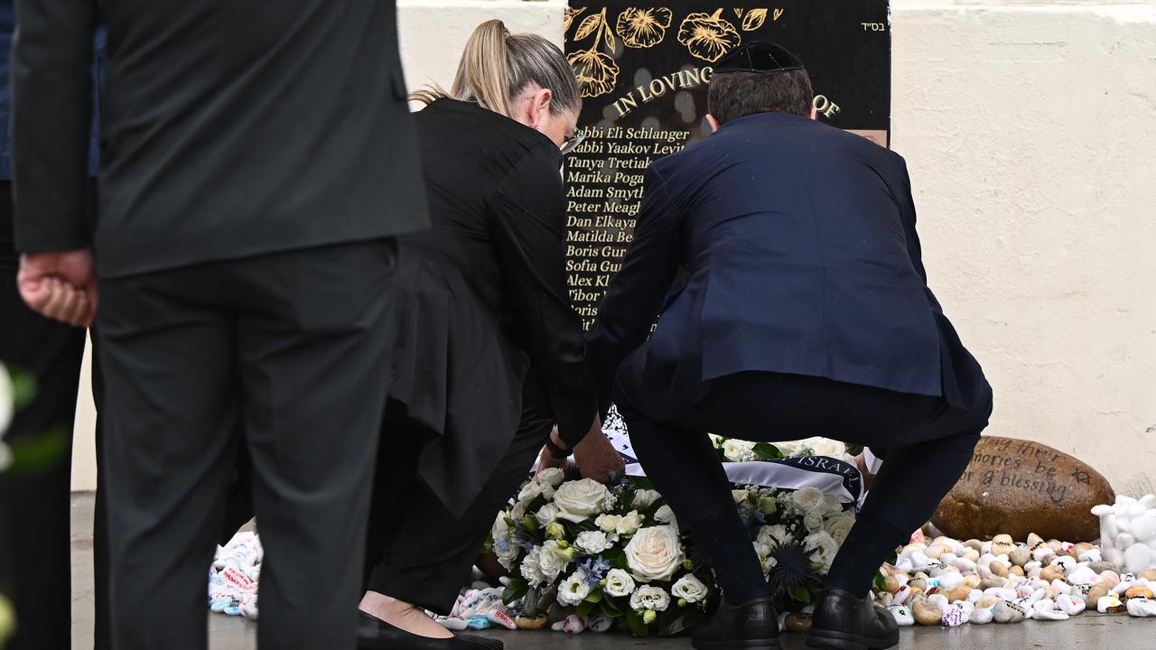Michal Herzog and Isaac Herzog lay a wreath