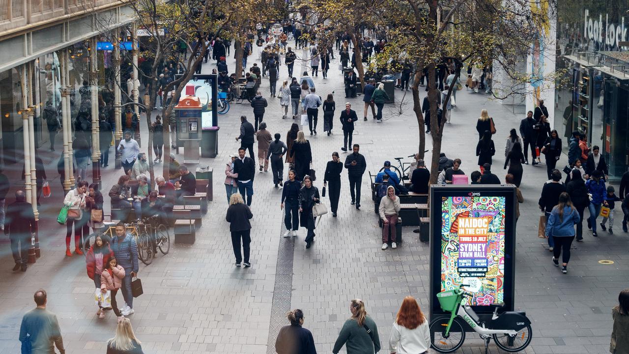 People move through Pitt Street in Sydney (file image)