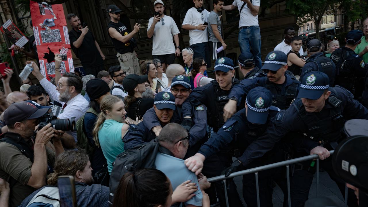 Police officers face-off with demonstrators