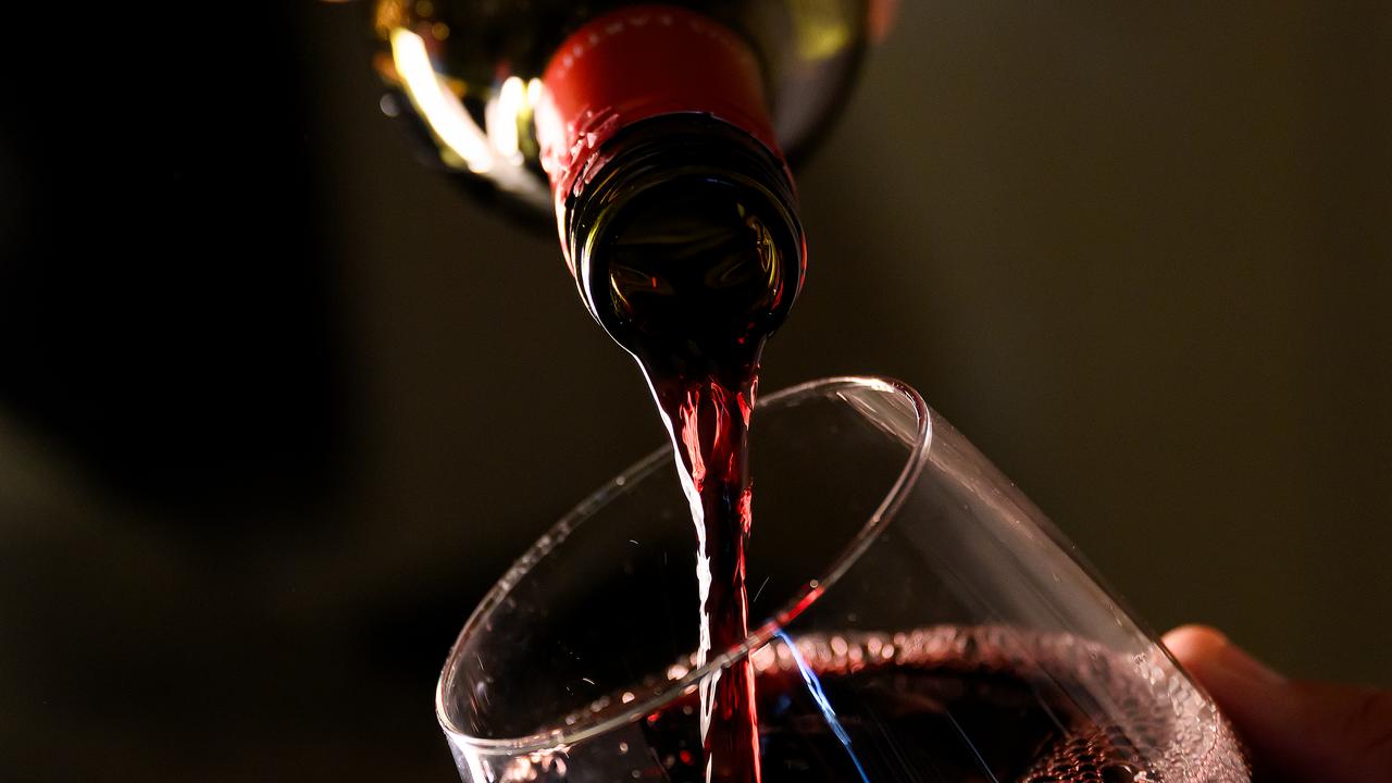 Wine being poured into a glass