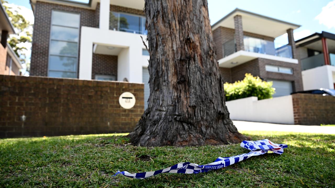 Police tape is seen at a house following a shooting in Greenacre