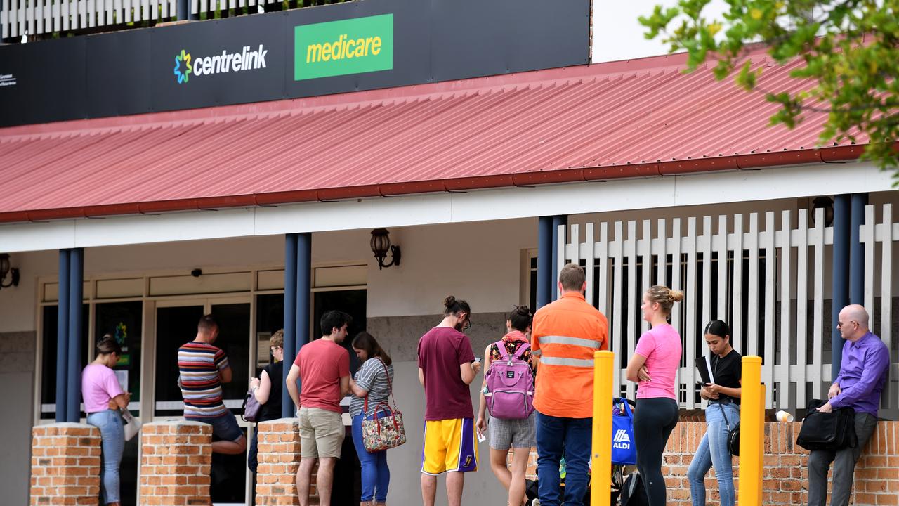 People queue outside a Centrelink office (file image)