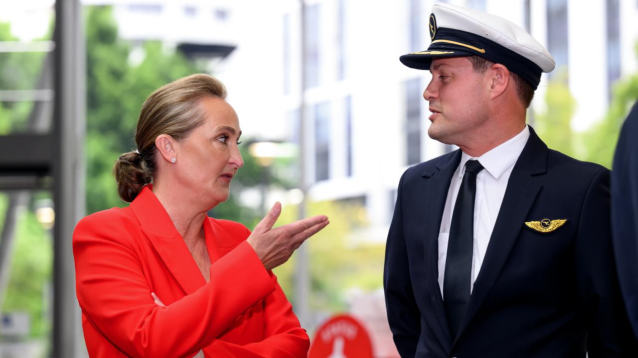 Qantas boss Vanessa Hudson chats to a colleague