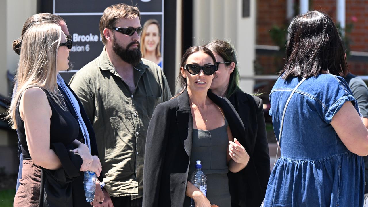 Danielle Carroll (centre), the sister of Kelly Wilkinson