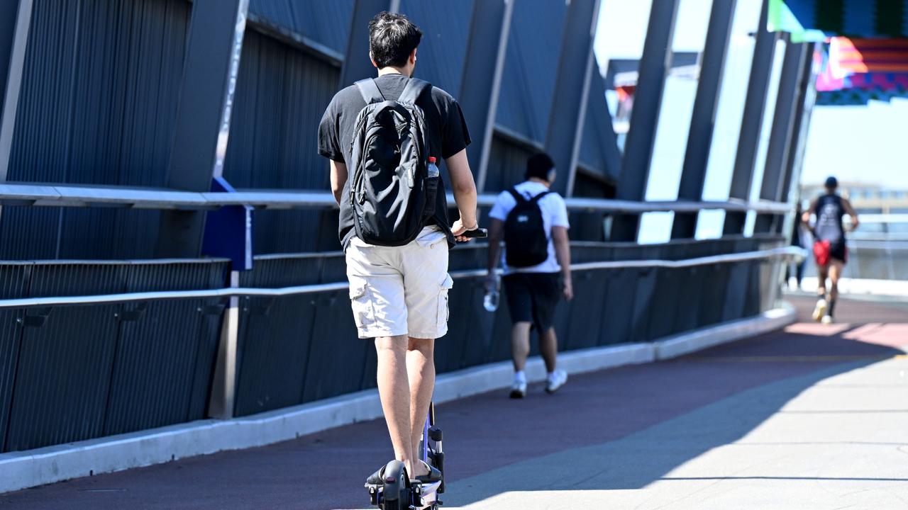 An e-scooter rider on the Goodwill Bridge at South Bank in Brisbane