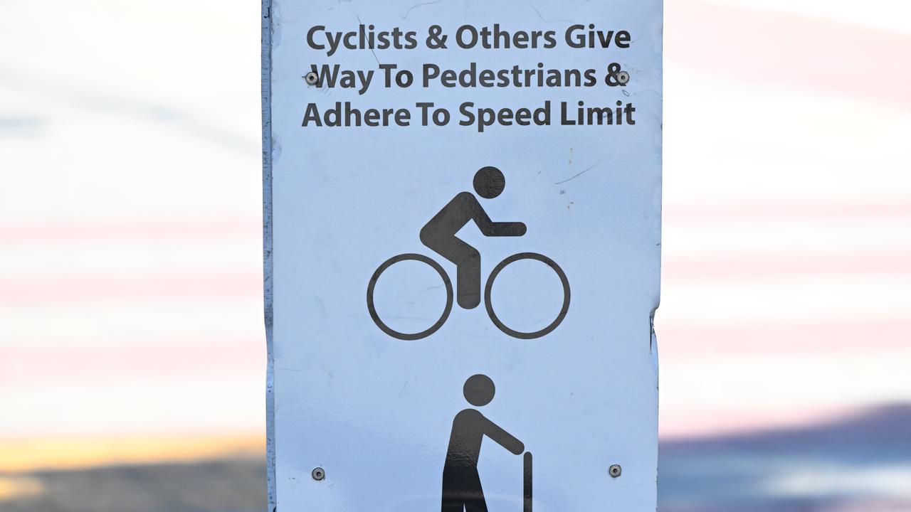 Warning sign for cyclists and scooter riders at South Bank, Brisbane