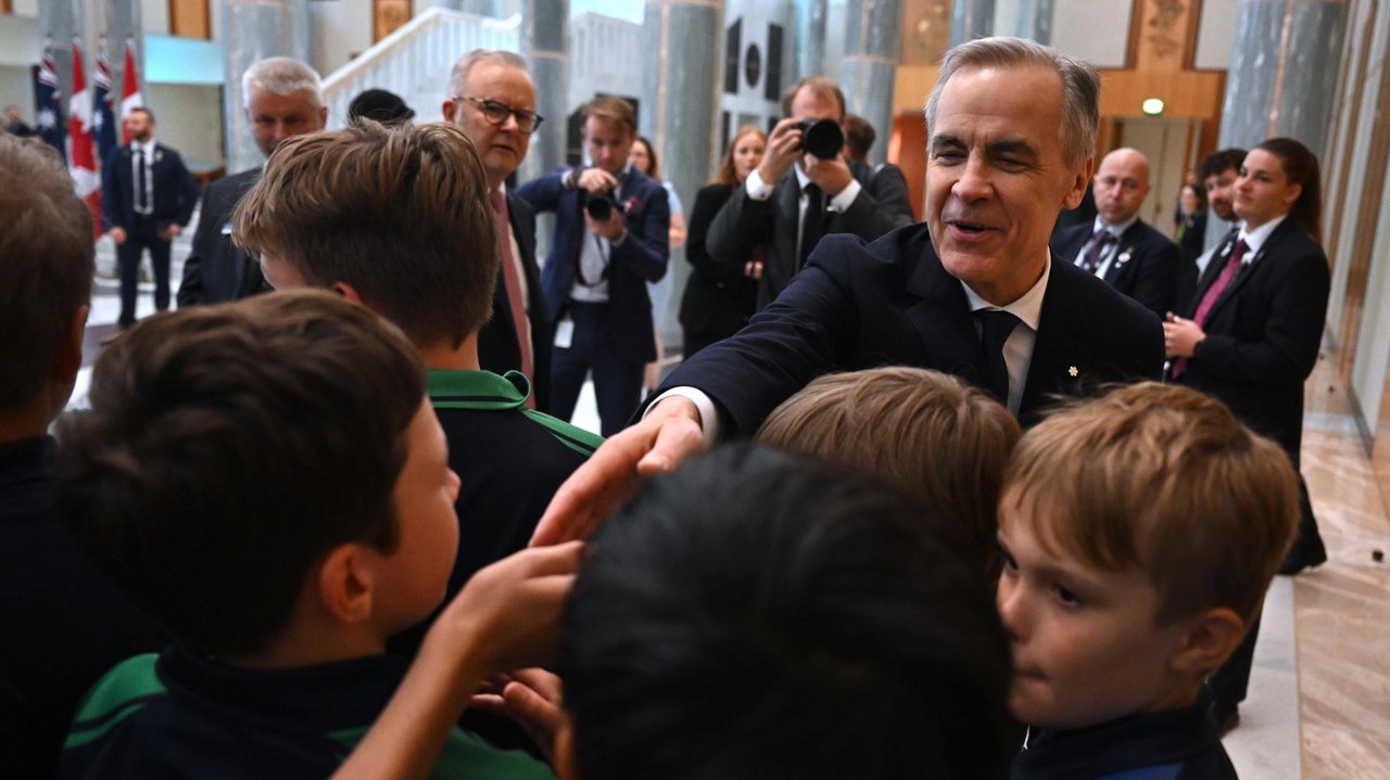 Mark Carney and school students