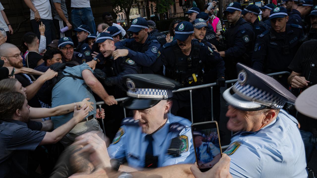 Police officers face-off with demonstrators