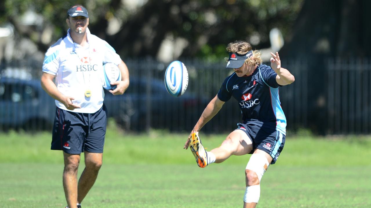 NSW Waratahs coach Michael Cheika keeps an eye on Berrick Barnes