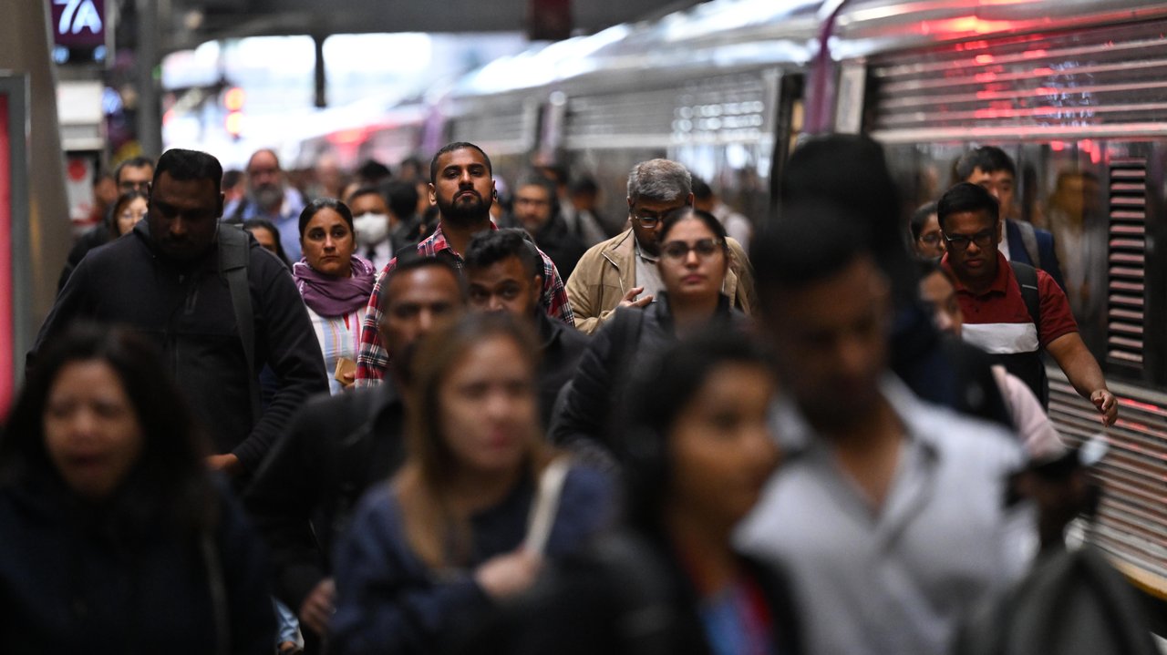 People are seen disembarking a V/Line train