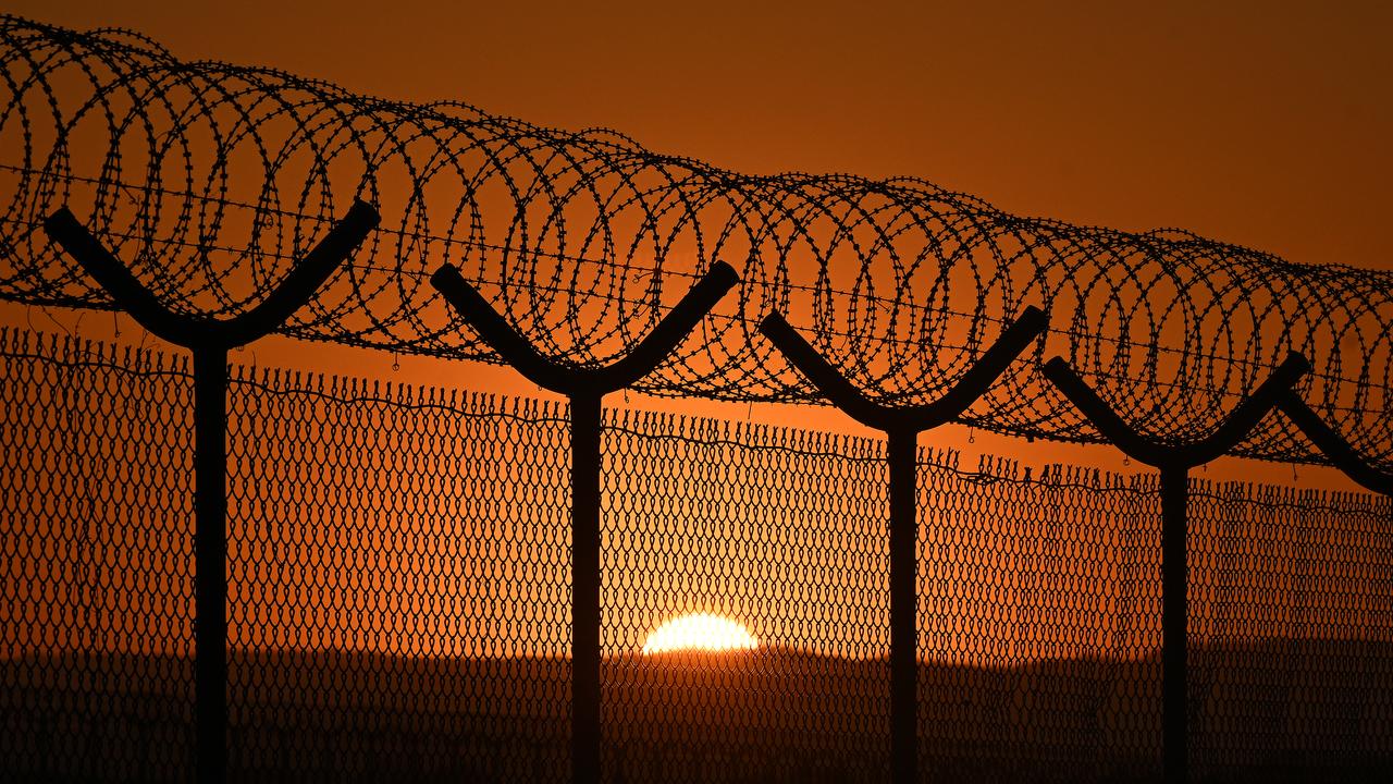 Barbed wire security fencing is seen at Brisbane Airport,