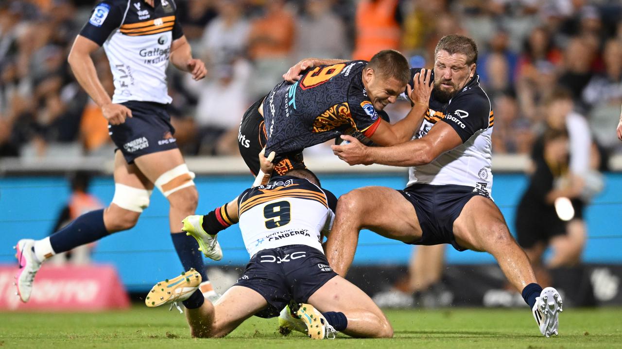 James Slipper (right) puts the brakes on the Chiefs' Cortez Ratima.